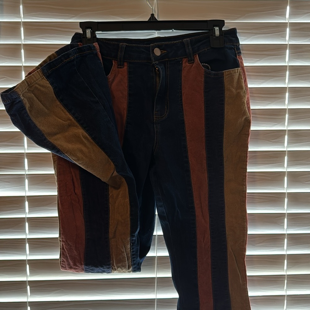 Size 4 tricolored Versona bootcut jeans (blue, burnt orange, tan).